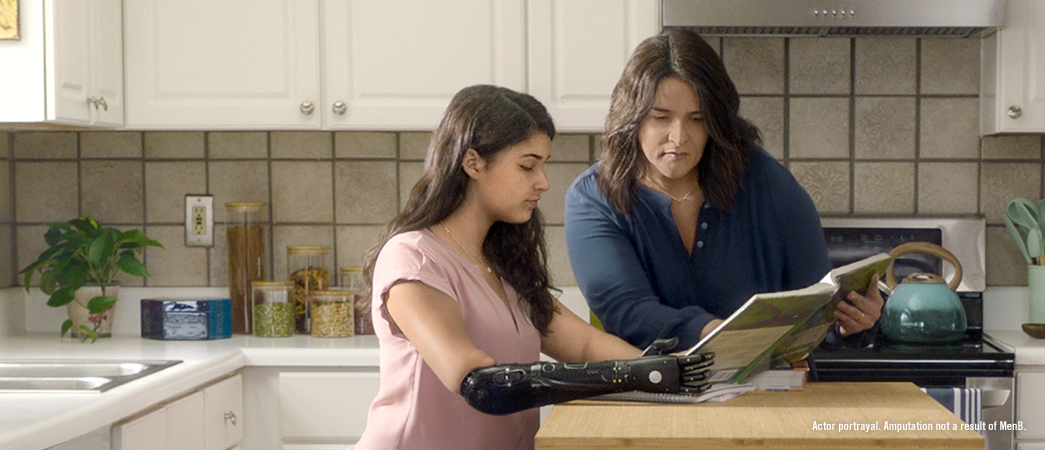 actor portrayal of mother and daughter doing homework at kitchen counter